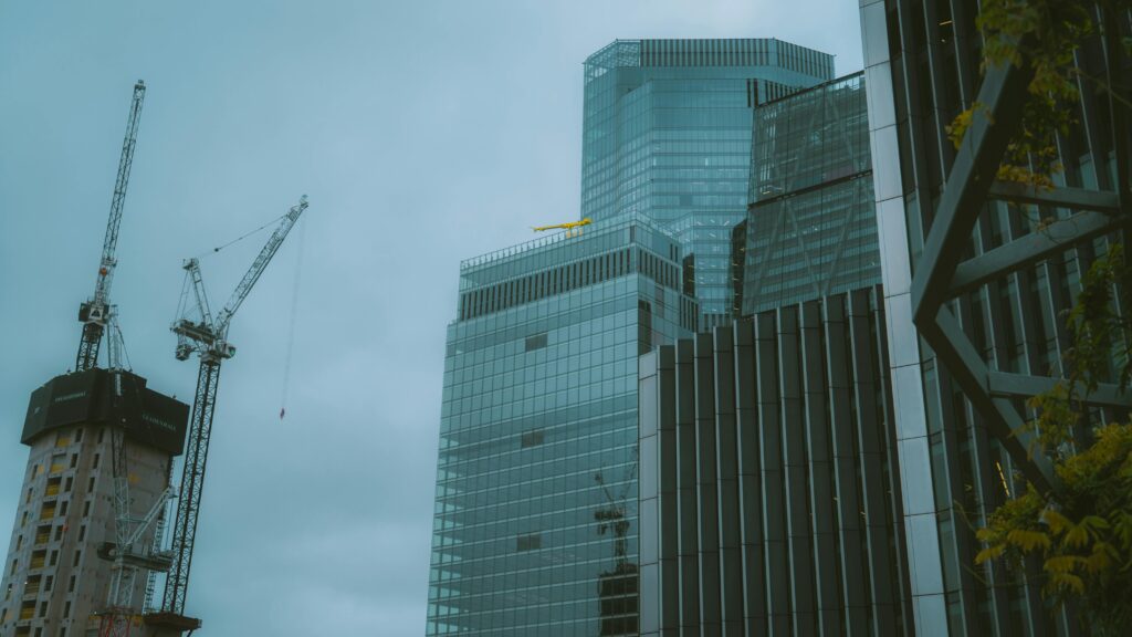 Urban cityscape of modern skyscrapers under construction in London, England.